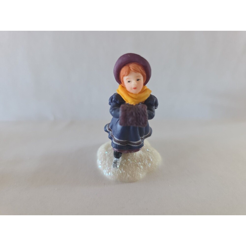 O'Well skating girl hand muff Victorian Christmas Village
